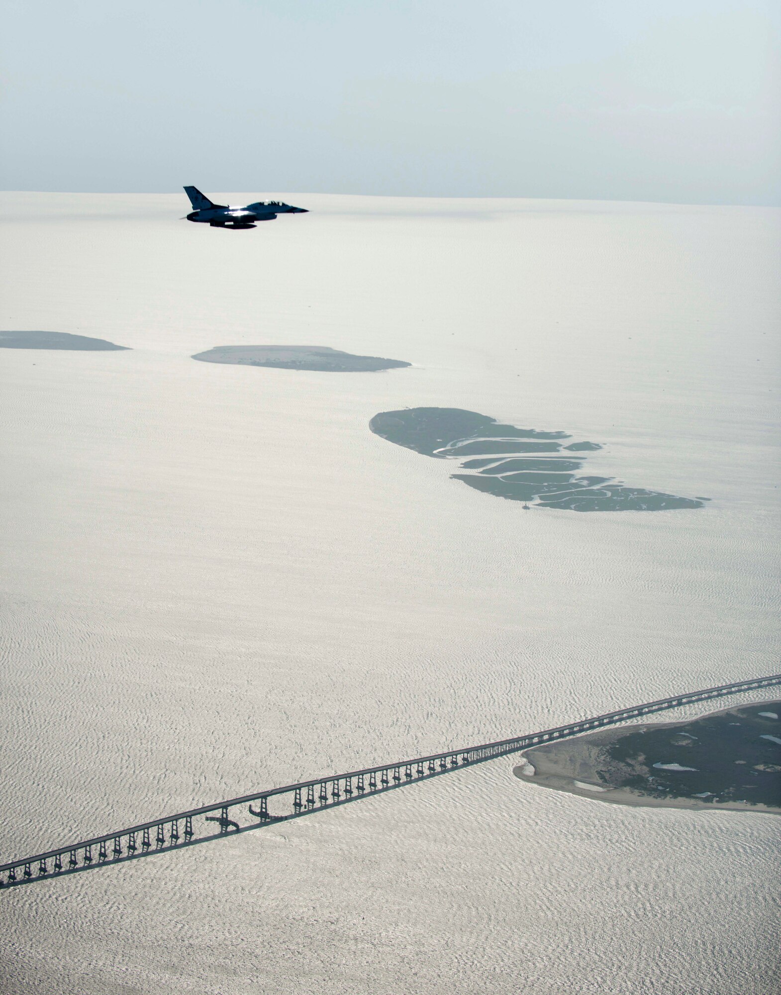 An F-16 Fighting Falcon with the U.S. Air Force Thunderbirds aerial demonstration team flies over the North Carolina Outer Banks, May 12, 2015. The 2015 Wings Over Wayne Airshow and Open House will be the first airshow in four years for Seymour Johnson Air Force Base, N.C., during which the Thunderbirds will perform along with other military and civilian aerial performances.(U.S. Air Force photo/Master Sgt. Jocelyn L. Rich-Pendracki) 