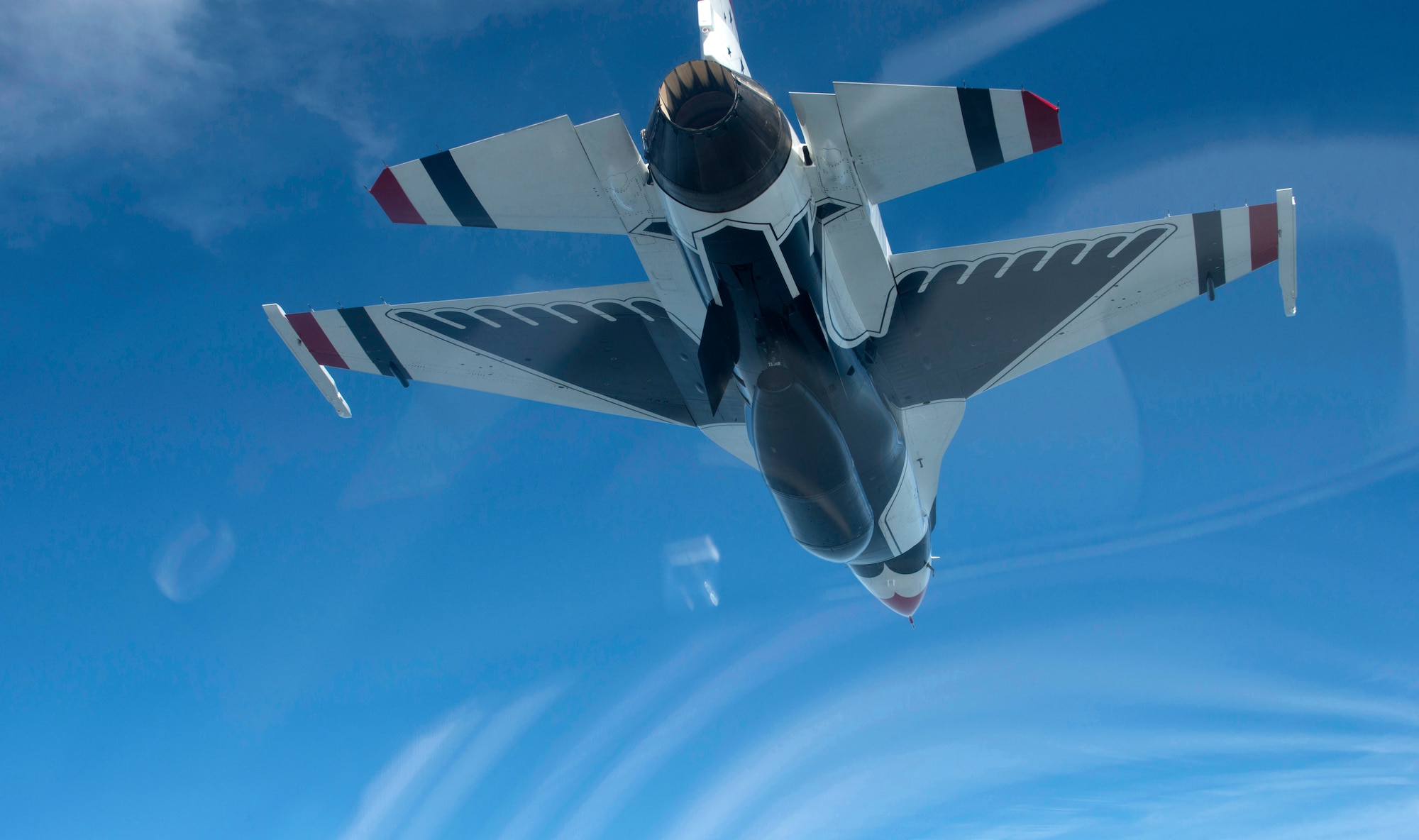 An F-16 Fighting Falcon with the U.S. Air Force Thunderbirds aerial demonstration team flies over North Carolina, May 12, 2015. The Thunderbirds will perform at the 2015 Wings Over Wayne Airshow and Open House will take place at Seymour Johnson Air Force Base, N.C., and feature aerial demonstrations, static displays, vendors and musical performances. (U.S. Air Force photo/Master Sgt. Jocelyn L. Rich-Pendracki) 