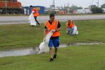 Volunteers from Joint Base San Antonio-Randolph’s Company Grade Officers Council pick up trash May 9 along Farm to Market Road 78 in conjunction with the “Don’t Mess with Texas Trash-Off” event. The “Trash-Off” is an annual event hosted by the Texas Department of Transportation to encourage volunteers to pick up litter along roadways, parks, neighborhoods and waterways throughout the state. (U.S. Air Force photo by Airman 1st Class Alexandria Slade/RELEASED)