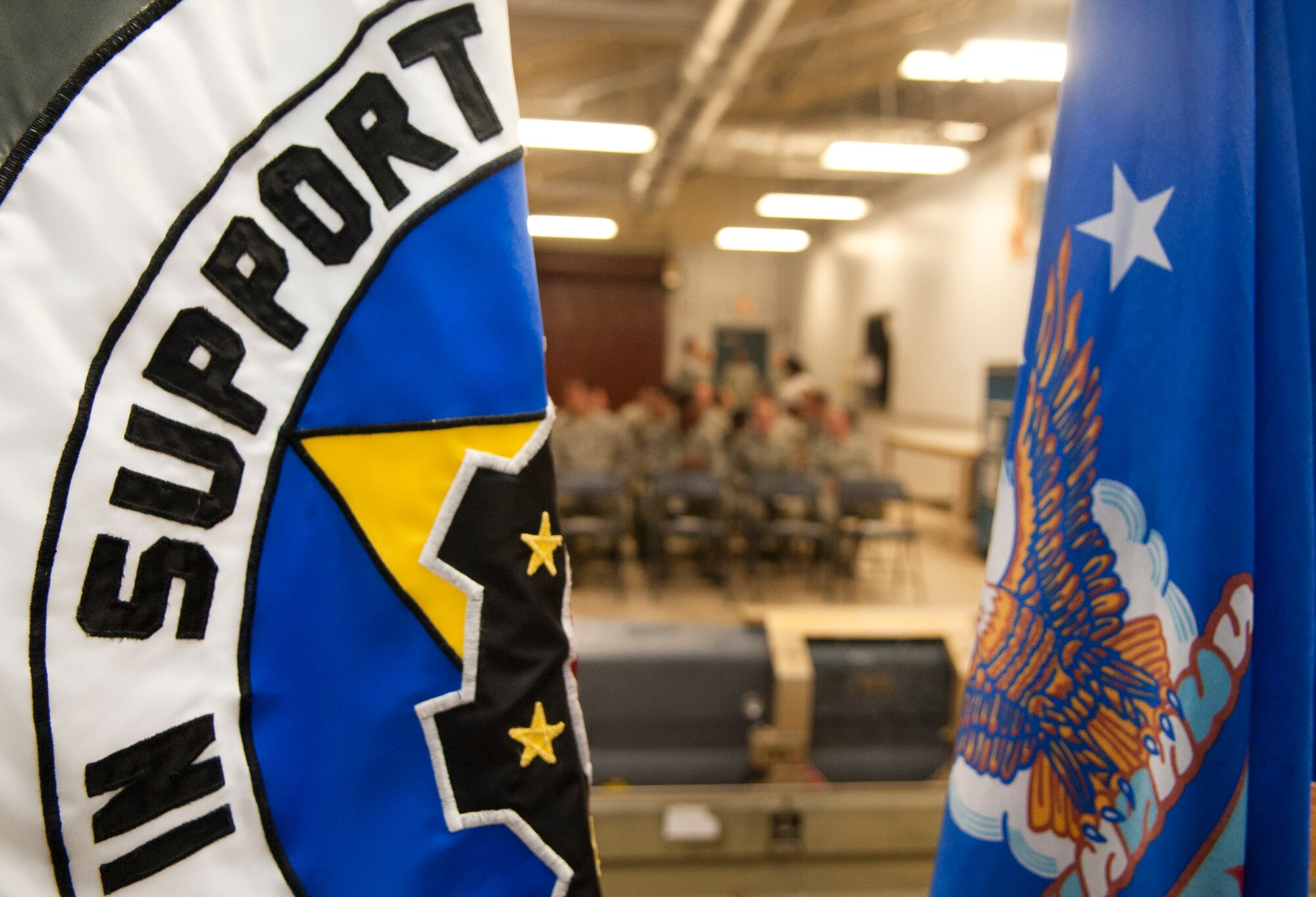 Airmen await the beginning of the 4th Component Maintenance Squadron Sensors Centralized Repair Facility deactivation ceremony, May 8, 2015, at Seymour Johnson Air Force Base, North Carolina. The CRF was established more than 10 years ago, and has serviced both Low-Altitude Navigation and Targeting Infrared System for Night and “Sniper” targeting pods for the last eight years. (U.S. Air Force photo/Senior Airman Ashley J. Thum)