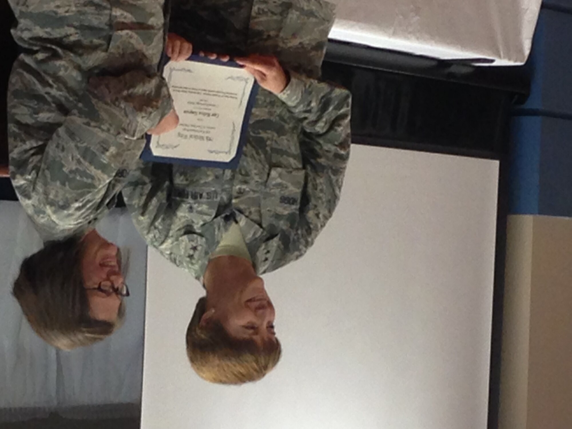 Major General Dorothy A. Hogg, Chief of the Air Force Nurse Corps, presents an award to Capt. Melissa Simpson and award at the 779th Medical Group's Job Knowledge Market on May 14, 2015 to celebrate Nurses and Medical Technician Month. The Job Knowledge
Market fair is a job fair for nurses that allow them the opportunity to discuss advances in the field of nursing.  Nurses from the Air Force, Army and Navy attended the presentation that was held at Malcolm Grow Medical Clinics and Surgery Center on Joint Base Andrews. (AF Photo by Melanie Moore, Public Affairs Officer.)
