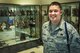 U.S. Air Force Tech. Sgt. Eric D. Hurtado, 316th Training Squadron military training leader flight chief, poses in front of a trophy case after winning the Top 3 Leadership Award at the 316th TRS dormitories on Goodfellow Air Force Base, Texas, May 14, 2015. Top 3 presents the leadership award on a monthly basis to highlight leadership excellence in the enlisted ranks. (U.S. Air Force photo by Senior Airman Michael Smith)