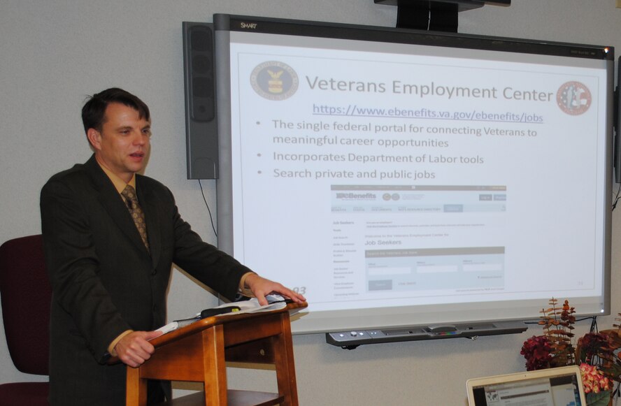 U.S. Department of Labor Employment Workshop instructor James Griffith, speaks about the importance of developing a job search plan to service members and guests attending the Transition Assistance Program Seminar May 13, 2015, at the Airman & Family Readiness Center on Grand Forks Air Force Base, N.D. Griffith retired as master sergeant from Air Force after approximately 23 years of military service. He now works as instructor and conducts DOL Employment Workshops at various military installations designed to help service members transitioning from military to civilian life. (U.S. Air Force photo by Staff Sgt. Luis Loza Gutierrez/released)