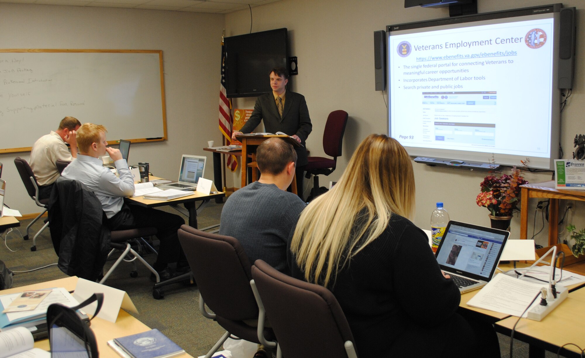 U.S. Department of Labor Employment Workshop instructor James Griffith, listens to a service member read the requirements listed on an online job posting on May 13, 2015, at the Airman & Family Readiness Center on Grand Forks Air Force Base, N.D. Griffith instructed approximately two dozen military and family members during the three-day long workshop, which covered multiple post-military service employment topics subjects such as job searches, building an effective resume and developing job interview skills. The workshop is part of a weeklong Transition Assistance Program seminar sponsored by the U.S. Department of Defense for individuals separating or retiring from military service. (U.S. Air Force photo Staff Sgt. Luis Loza Gutierrez/released)