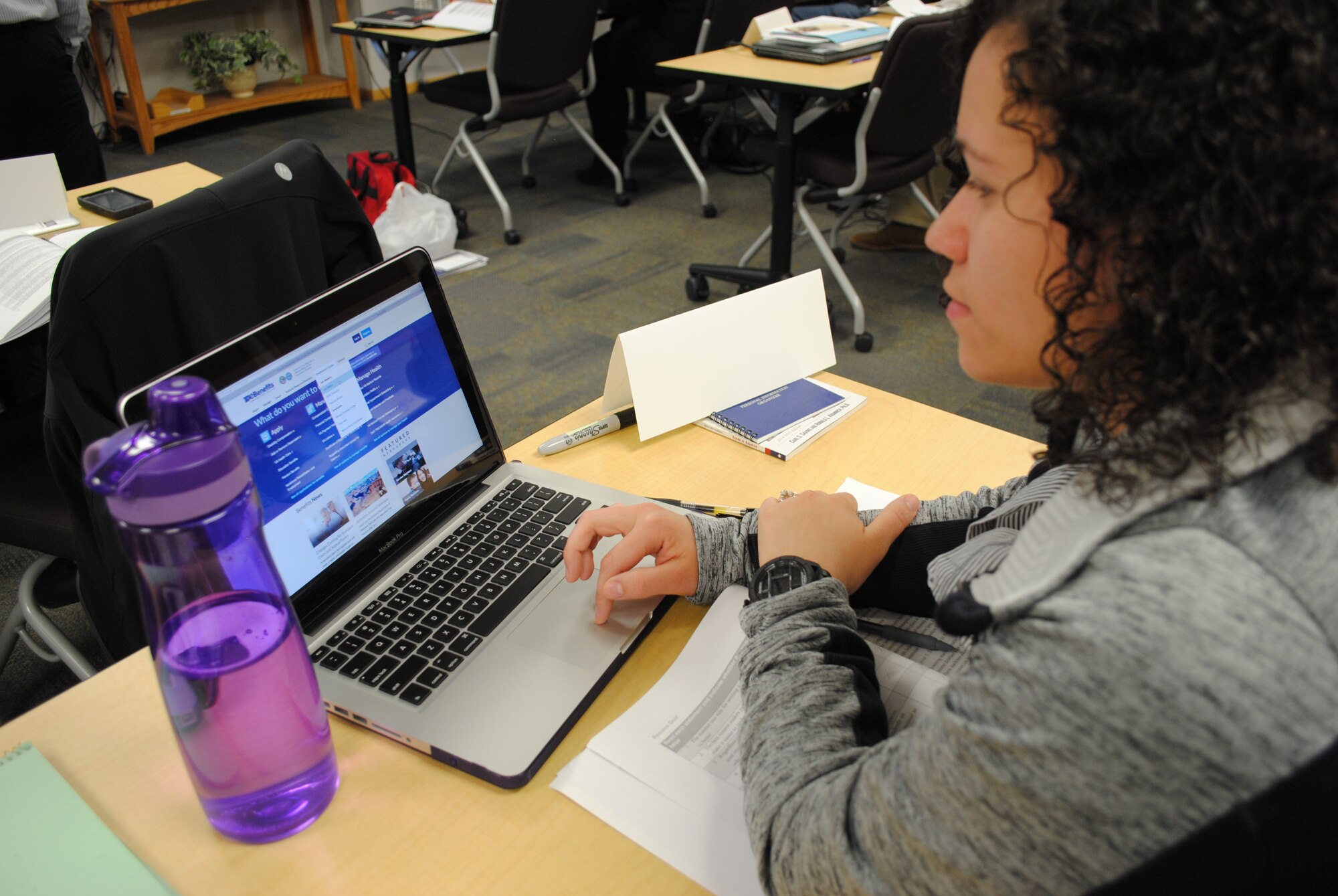 Senior Airman Keyla Colon from the 319th Security Forces Squadron explores the links under the Veterans Employment Center tab of ebenefits.va.gov home website on May 13, 2015, at the Airman & Family Readiness Center on Grand Forks Air Force Base, N.D. The VEC is one of the newest additions to the service website provided for free by the Department of Veteran Affairs and the Department of Defense. The VEC features links that allow web users to perform job searches, build their resumes and translate their military skills to the civilian sector. (U.S. Air Force photo by Staff Sgt. Luis Loza Gutierrez/released)