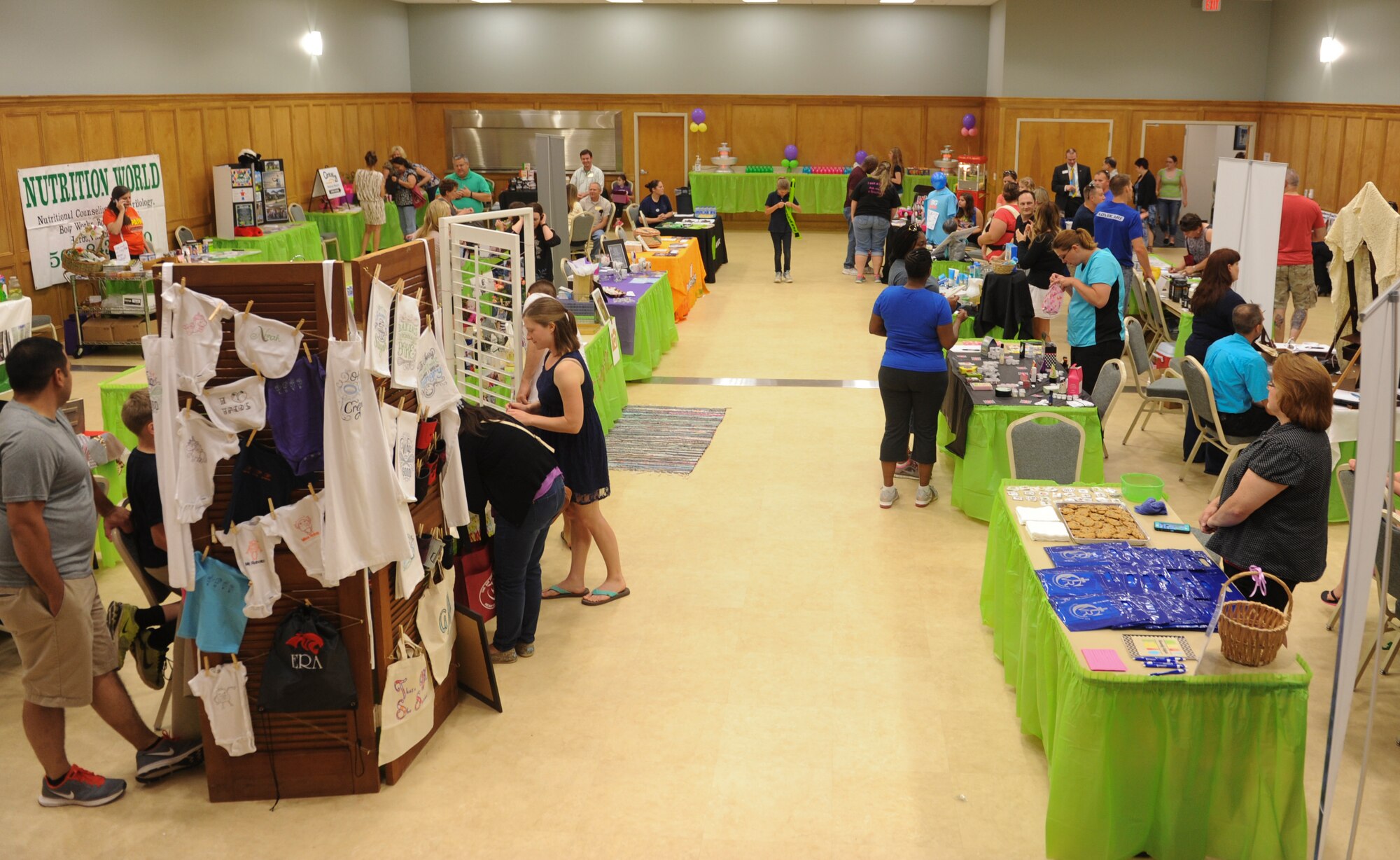 Team Little Rock members participate in the Airman and Family Readiness Center’s 2nd Annual Military Spouse Appreciation Bazaar May 8, 2015, at Little Rock Air Force Base, Ark. The many vendors and information tables included the Chapel, Airman and Family Readiness Center, Military One Source and spouse-owned businesses. (U.S. Air Force photo by Senior Airman Scott Poe)