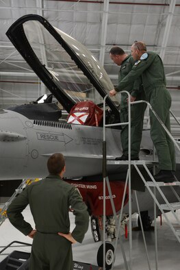 Members of the Polish Air Force spend time looking at aircraft in the phase hangar at the 115th Fighter Wing in Madison, Wis., May 4, 2015. Two pilots and three maintainers from Poland spent the week learning about the differences between their air force and the Air National Guard as a part of the State Partnership Program. (U.S. Air National Guard photo by Senior Airman Andrea F. Rhode)