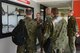 Members of the Polish Air Force receive a history lesson in the operations building at the 115th Fighter Wing in Madison, Wis., May 4, 2015. Two pilots and three maintainers from Poland spent the week learning about the differences between their air force and the Air National Guard as a part of the State Partnership Program. (U.S. Air National Guard photo by Senior Airman Andrea F. Rhode)