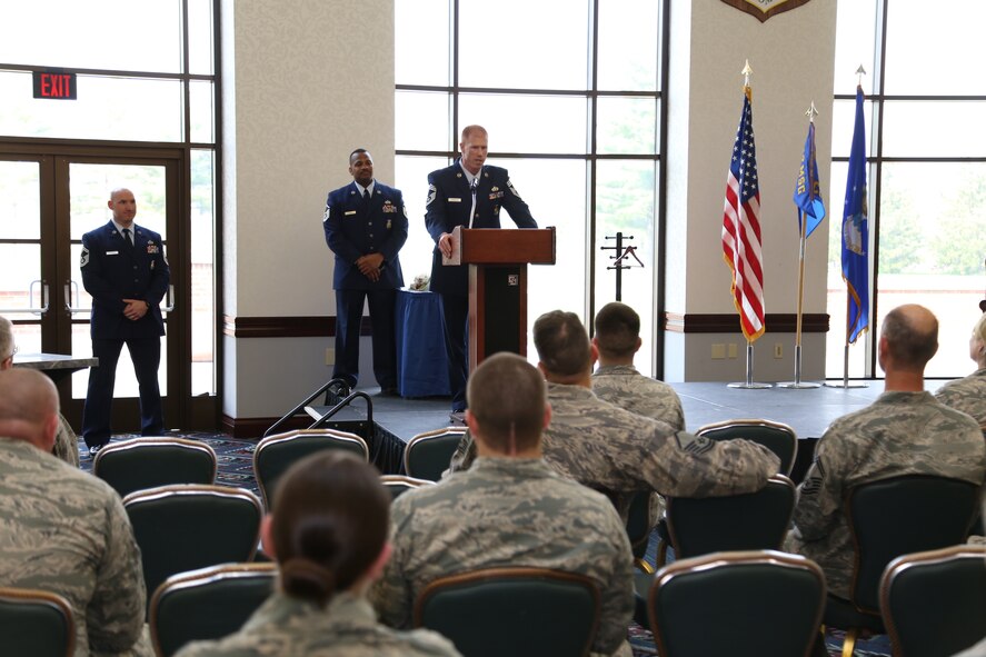 Chief Master Sgt. Shawn Conway, newly appointed 932nd Airlift Wing fire chief, speaks to fellow fire fighters and the rest of the wing during a very emotional promotion ceremony recently at the Scott Club, Scott Air Force Base.  Conway spoke about some influential mentors in his life and the importance of family that helped him earn his new rank. (U.S. Air Force photo / Tech. Sgt. Christopher Parr)