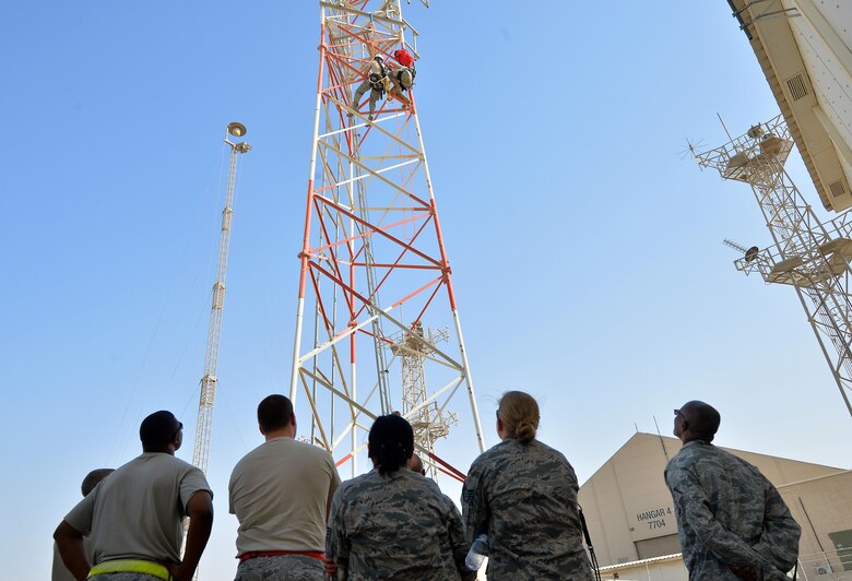 Base personnel observe a climbing demonstration in support of the Air Force fall protection focus initiative at an undisclosed location in Southwest Asia May 11, 2015. According to the Air Force Safety Center website, The Fall Protection Focus alerts the entire Air Force family - active duty, civilian, Guard, Reserve and family members - of what can be done to prevent fall-related injuries and deaths. (U.S. Air Force photo/Tech. Sgt. Jeff Andrejcik) 