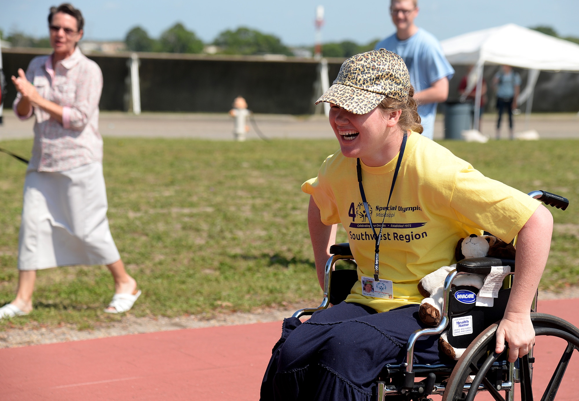 Britni Welch, Special Olympics athlete, participates in the wheelchair race at the 2015 Mississippi State Special Olympics, May 9, 2015, Keesler Air Force Base, Miss. Welch participated in the wheelchair race and tennis ball throw for her age group and won the gold medal in both sports. (U.S. Air Force photo by Senior Airman Holly Mansfield)