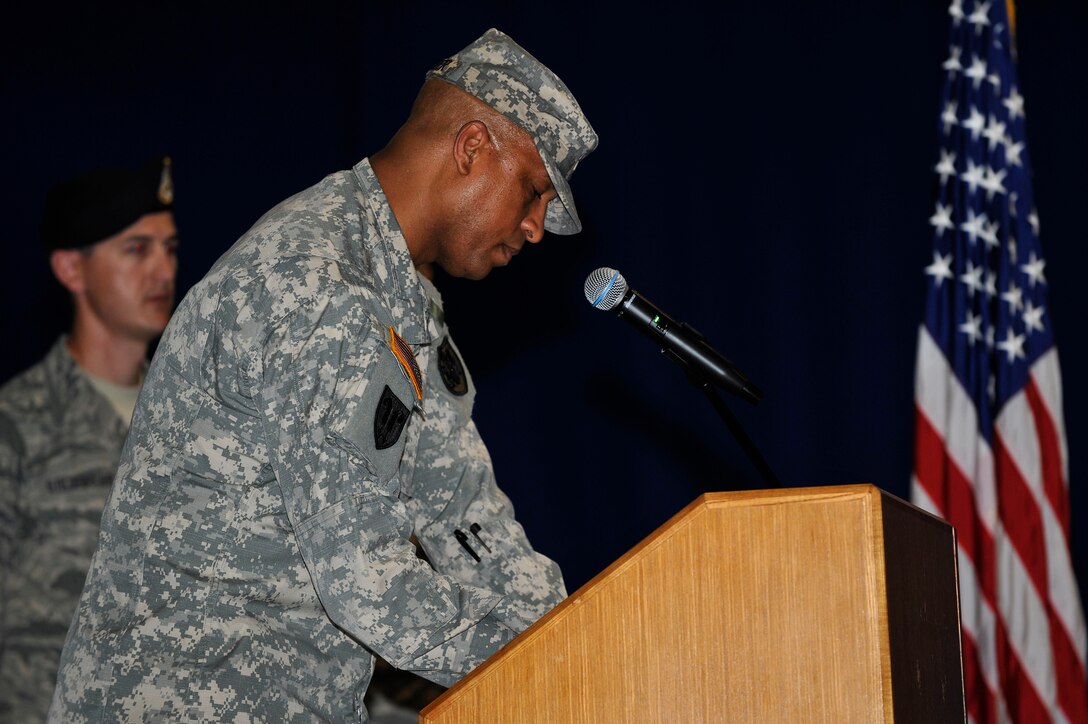 U.S. Army Col. Joseph Ladner, 633rd Air Base Wing vice commander, signs a proclamation during the National Peace Officers’ Memorial Ceremony, at Langley Air Force Base, Va., May 11, 2015. The proclamation officially started Joint Base Langley-Eustis’ Police Week. (U.S. Air  Force photo by Senior Airman Breonna Veal/Released)