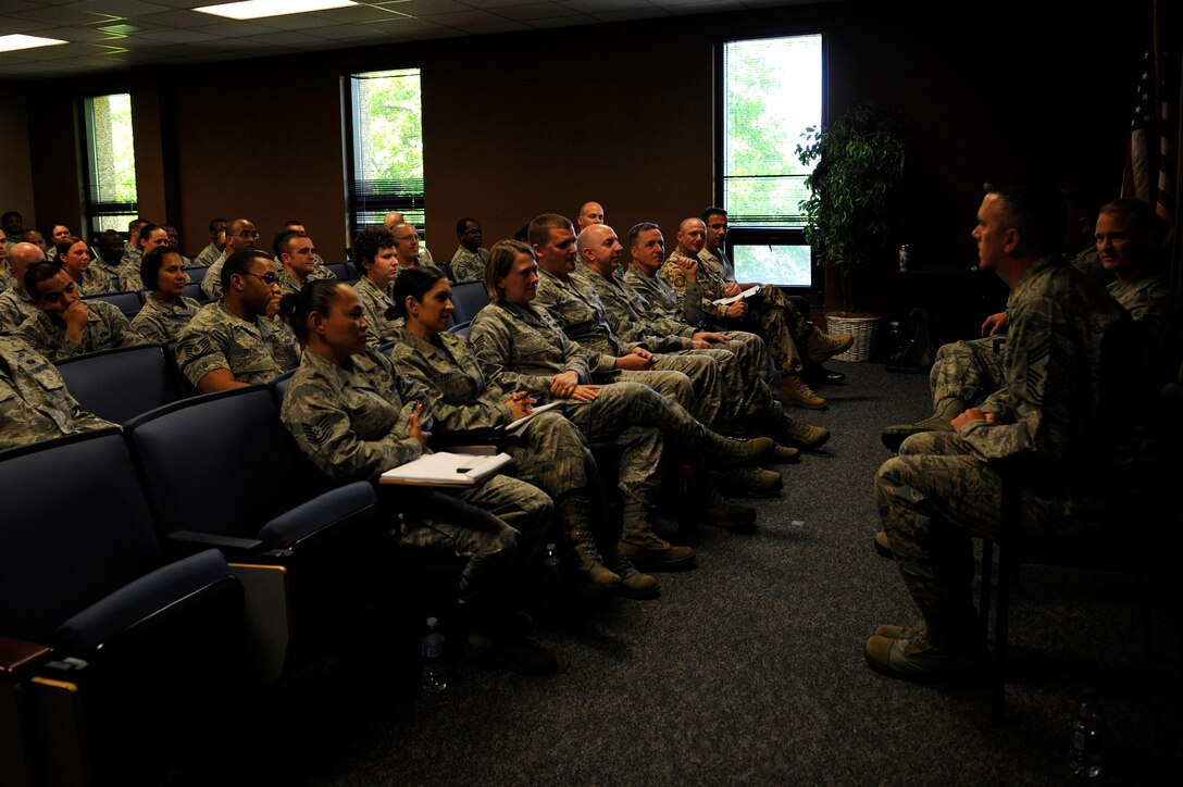 U.S. Service members listen to U.S. Air Force Chief Master Sgt. John Thompson, 480th Intelligence, Surveillance and Reconnaissance command chief, talk about his experiences as a young Airman during a first sergeants seminar at Langley Air Force Base, Va., May 8, 2015. Only master sergeants, senior master sergeants and chief master sergeants can apply to be a first sergeant because they are in the top tier of the enlisted rank structure. (U.S. Air Force photo by Senior Airman Breonna Veal/Released)  