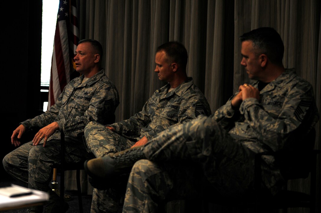 U.S. Air Force Chief Master Sgt. Emmette Bush, 1st Fighter Wing command chief, from left, Chief Master Sgt. Mark Hurst, 633rd Air Base Wing command chief, and Chief Master Sgt. John Thompson, 480th Intelligence, Surveillance and Reconnaissance command chief, speak to technical sergeants and above about the roles of being a first sergeant at Langley Air Force Base, Va., May 8, 2015. According to the chiefs, being a first sergeant is a special duty assignment job that requires advisement to the commander on issues related to the enlisted force. (U.S. Air Force photo by Senior Airman Breonna Veal/Released)