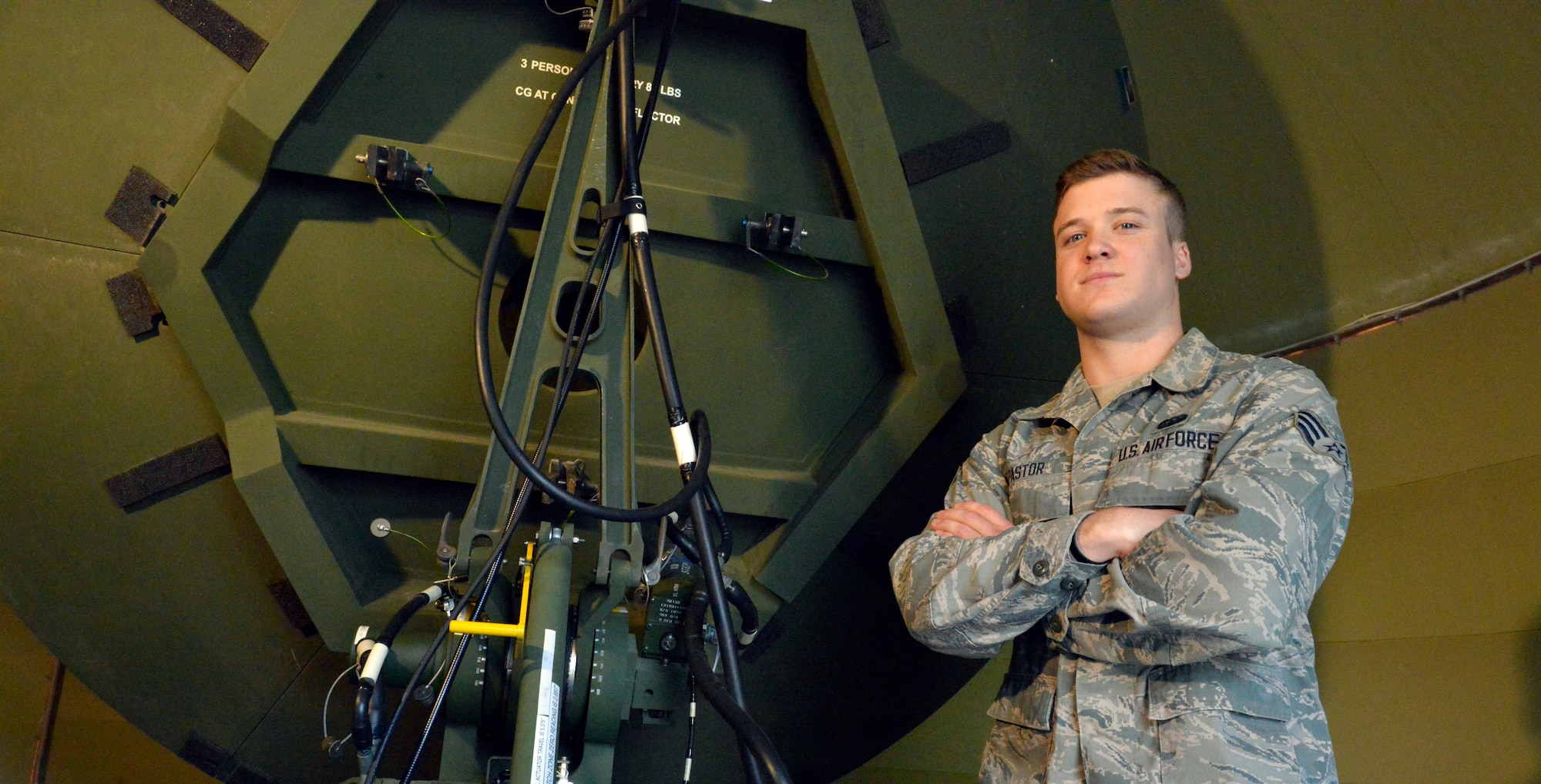 Senior Airman Ryan Pastor, 460th Space Communications Squadron radio frequency transmissions system journeyman, poses beside a radio dish May 4, 2015, at Ramstein Air Base, Germany. Pastor was selected to attend the U.S. Air Force Academy’s preparatory school via the Leaders Encouraging Airman Development program. After completing the preparatory school, he will enter the Academy as a cadet and potential officer. (U.S. Air Force photo by Airman 1st Class Lane T. Plummer/Released)