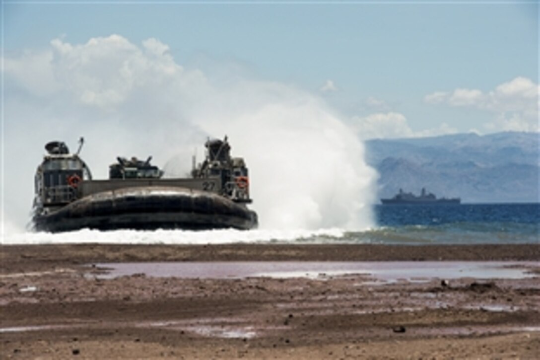 Landing Craft Air Cushion 27 transports U.S. Marines from the amphibious transport dock ship USS New York to shore in Djibouti, May 6, 2015. The Marines are assigned to the 24th Marine Expeditionary Unit, and the landing craft is assigned to the U.S. Navy’s Assault Craft Unit 4.