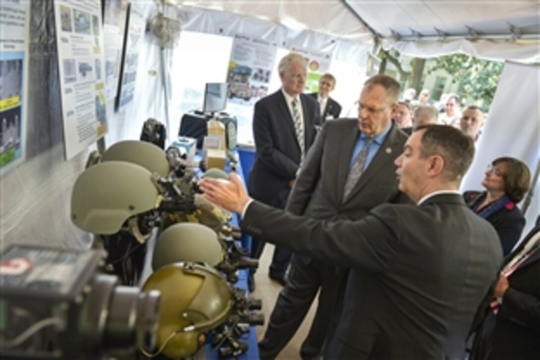 Deputy Defense Secretary Bob Work tours an exhibit featuring optical scopes for combat troops before making remarks for the opening of the Defense Department's first Lab Day at the Pentagon, May 14, 2015. 