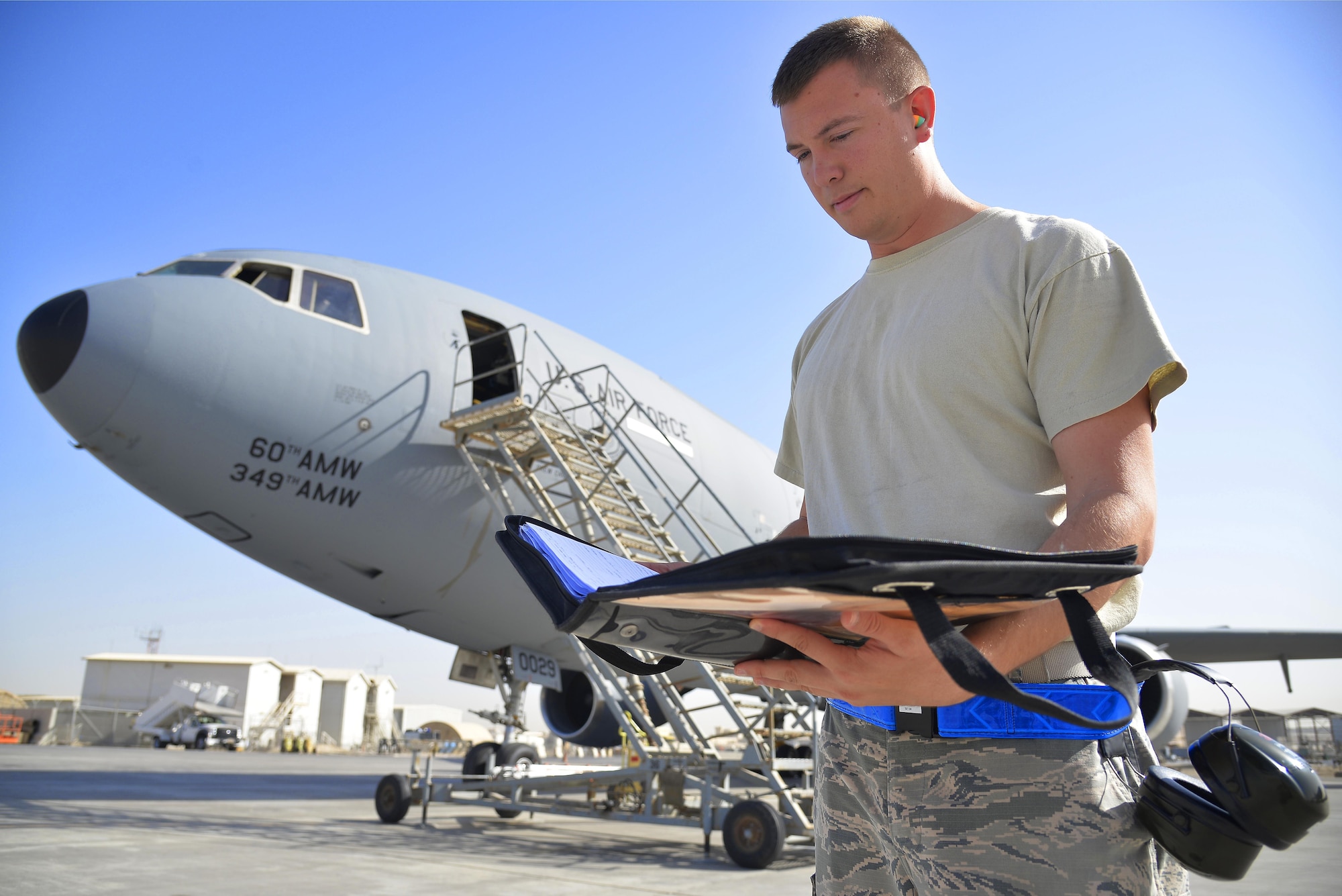 Staff Sgt. Michael reviews an inspection checklist for a KC-10 Extender at an undisclosed location in Southwest Asia May 12, 2015. Michael is a crew chief assigned to the 380th Expeditionary Aircraft Maintenance Squadron. Due to safety and security reasons, last names and unit designators were removed. (U.S. Air Force photo/Tech. Sgt. Christopher Boitz)