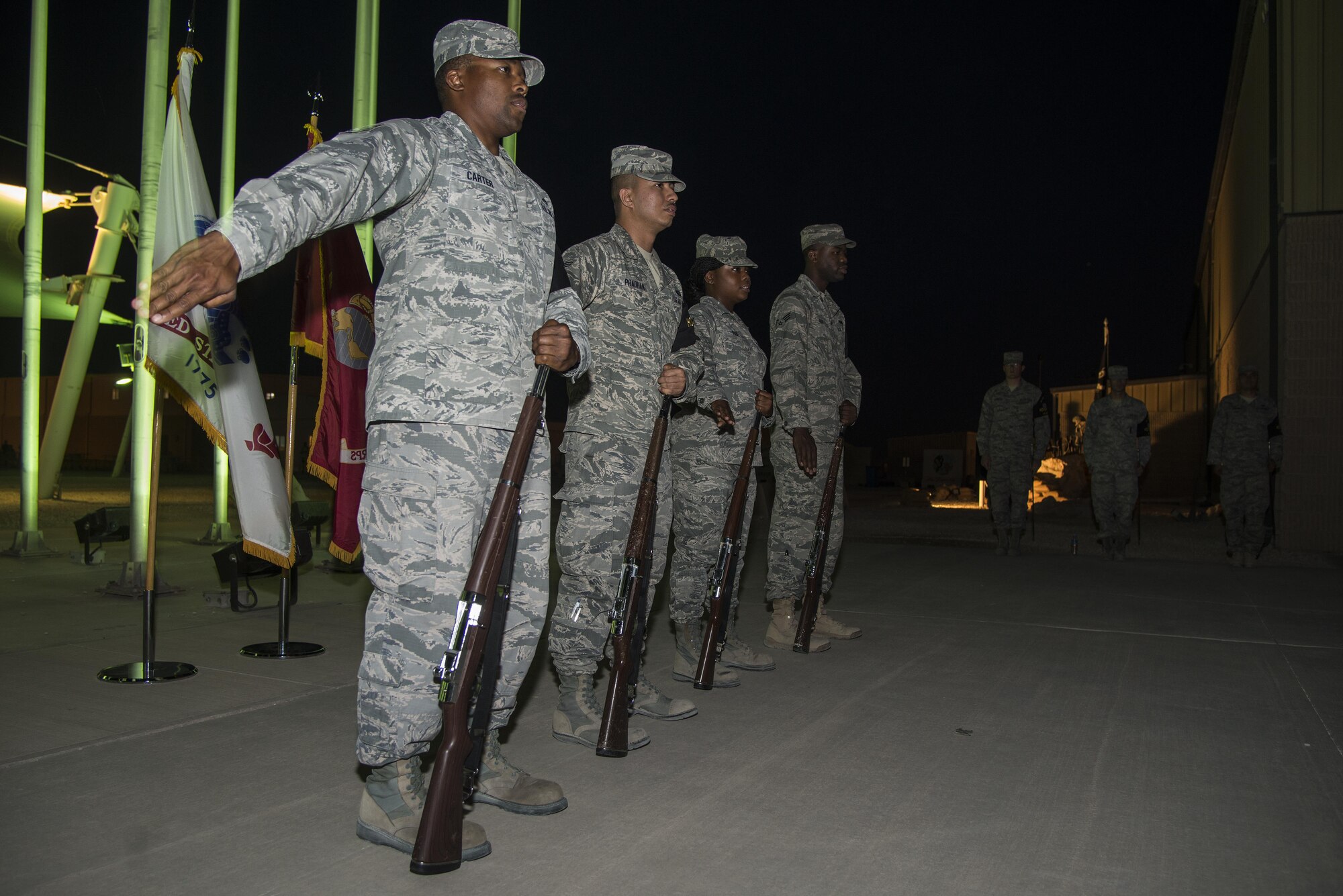 Members of the Team Al Udeid Honor Guard practice the proper use of ceremonial rifles during training May 11, 2015, at Memorial Plaza on Al Udeid Air Base, Qatar. They train two days a week to practice and perfect their movements for any possible scenario while keeping their military bearing so they don't disrupt members in the audience during their details. (U.S. Air Force photo by Tech. Sgt. Douglas)