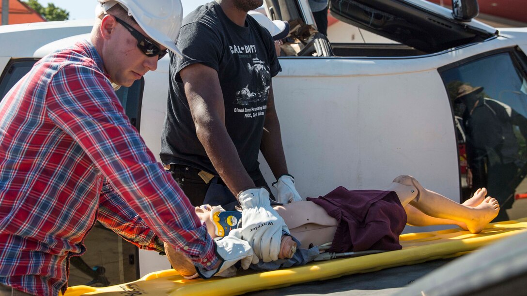 Hospital Corpsman 2nd Class (FMF) Matthew Powell (left) and Hospitalman Dante Johnson (right), both hospital corpsmen with Headquarters and Support Company, 1st Battalion, 4th Marine Regiment, Marine Rotational Force – Darwin, worked on reviving a patient during a real world application during a Remote Pre-Hospital Trauma and Disaster Course May 13 at the Marrara Fire Department, Northern Territory, Australia. The course refreshed the corpsmen’s basic casualty care response skills and provided them with lectures, skills lab and real world practical application addressing mass casualty care in remote areas. The MRF-D deployment enables Marines and sailors to effectively train, exercise and operate with partner to enhance regional security and build the capacity to respond more rapidly to natural disasters and crises throughout the region. Powell is a native of Littlerock, Arkansas and Johnson is a native of Chicago, Illinois. (U.S. Marine Corps photo by Cpl. Reba James/Released)