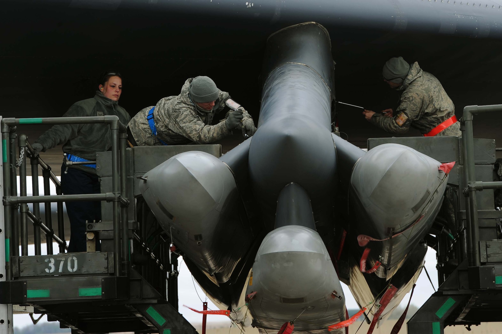 Weapons loaders assigned to Air Force Global Strike Command secure air-launched cruise missiles on a B-52H Stratofortress during an aircraft generation event during Exercise Constant Vigilance at Minot Air Force Base, N.D., May 7, 2015. Training and exercise participation hones AFGSC's nuclear deterrence and long-range strike capabilities, ensuring the command is ready to support the president and combatant commanders if and when called upon to do so. (U.S. Air Force photo/Senior Airman Kristoffer Kaubisch)