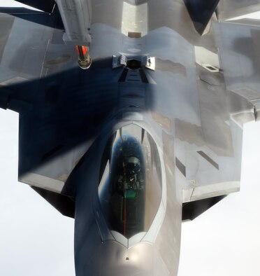 An F-22 Raptor assigned to the 525th Fighter Squadron from Joint Base Elmendorf-Richardson, Alaska, maneuvers into refueling position after conducting an air combat maneuvering sortie over Alaska, May 7, 2015. The F-22 was refueled by a KC-10 Extender from the 76th Air Refueling Squadron, at Joint Base McGuire-Dix-Lakehurst, N.J. (U.S. Air Force photo/Staff Sgt. Sheila deVera)