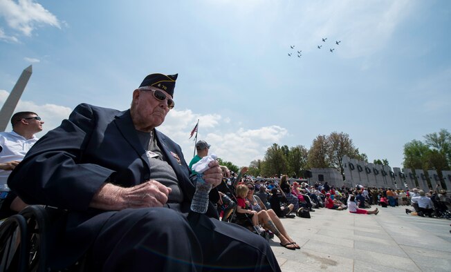 Don Egolf, a World War II veteran, watches a flyover at the National World War II Memorial in Washington D.C., May 8, 2015. The flyover was part of a 70th anniversary of V-E Day commemoration. (U.S. Air Force photo/Airman 1st Class Phillip Bryant)