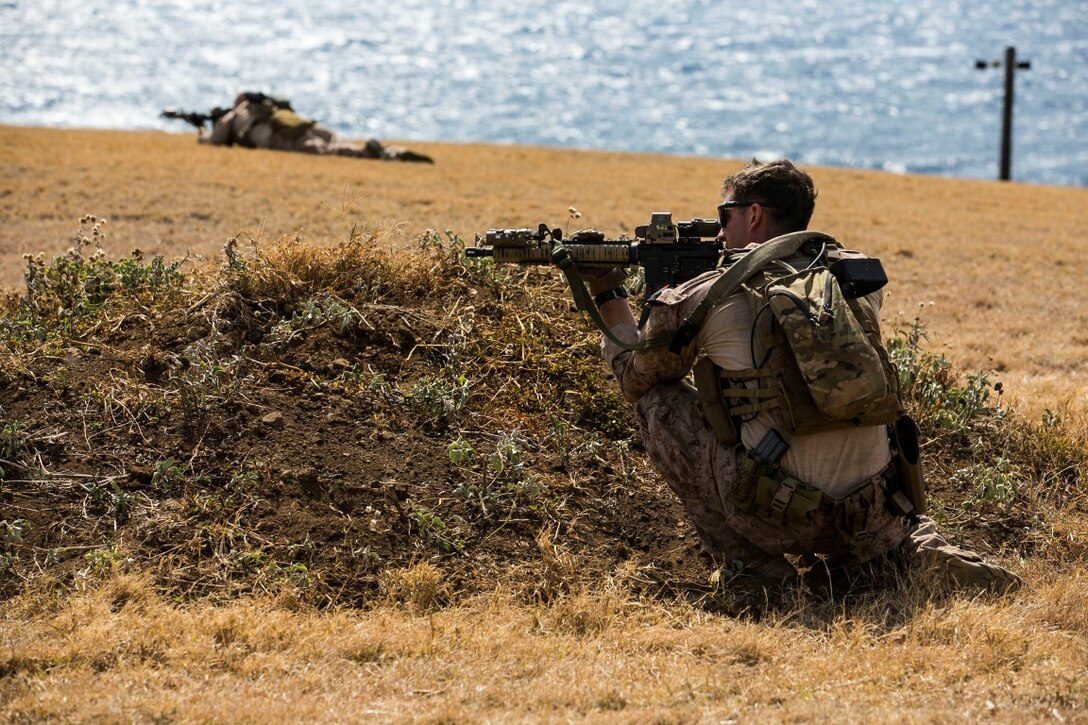 U.S. Marine Sgt. Erik Maehler aims in on his target at a fire-and-maneuver range aboard Marine Corps Base Hawaii, May 11, 2015. Maehler is a team leader with the 15th Marine Expeditionary Unit’s Maritime Raid Force. The MRF is taking advantage of training opportunities in Hawaii as they transit the Pacific during deployment with the 15th MEU.  (U.S. Marine Corps photo by Cpl. Anna Albrecht/Released)