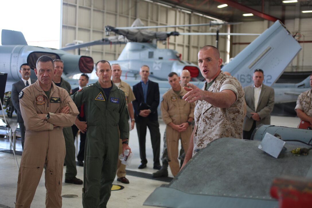Sgt. Mike Winn, an airframes work center supervisor with Marine Aviation Logistics Squadron 39 and an Albany, New York, native, conducts a presentation during ‘Boots on the Ground’ aboard Marine Corps Air Station Camp Pendleton, California, April 27. Leaders from the Naval Aviation Enterprise visited elements of Marine Aircraft Group 39 during this event, linking NAE representatives with Marines and Sailors working with aircraft. (U.S. Marine Corps photo by Sgt. Melissa Wenger/Released)