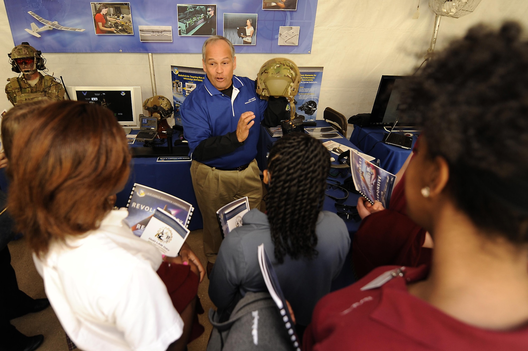 Michael Sedillo, human effectiveness directorate with the Air Force Research Laboratory, describes the capabilities of the Battlefield Air Targeting Man-Aided Knowledge (BATMAN) system during the Department of Defense Lab Day at the Pentagon in Washington D.C. May 14, 2015. Lab Day showcased innovations from more than 60 Air Force, Army, Marine, Navy and medical laboratories and engineering centers across the country and was open to members of Congress, STEM-participating high schools, media and special guests. (U.S. Air Force photo/Tech. Sgt. Dan DeCook)