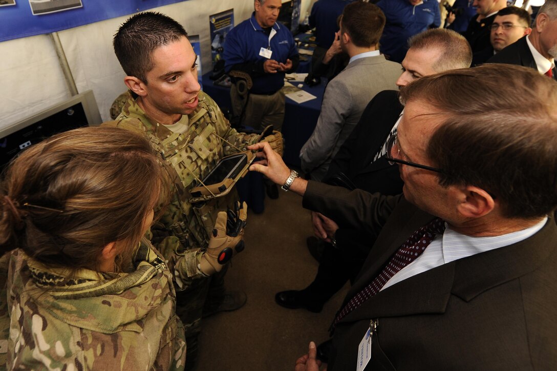 Second Lt. Anthony Eastin, behavioral scientist with the Air Force Research Laboratory, describes the capabilities of the Battlefield Air Targeting Man-Aided Knowledge (BATMAN) system, during the Department of Defense Lab Day at the Pentagon in Washington D.C. May 14, 2015. Lab Day showcases innovations from more than 60 Air Force, Army, Marines, Navy and Medical laboratories and engineering centers across the country. (U.S. Air Force photo/Tech. Sgt. Dan DeCook)