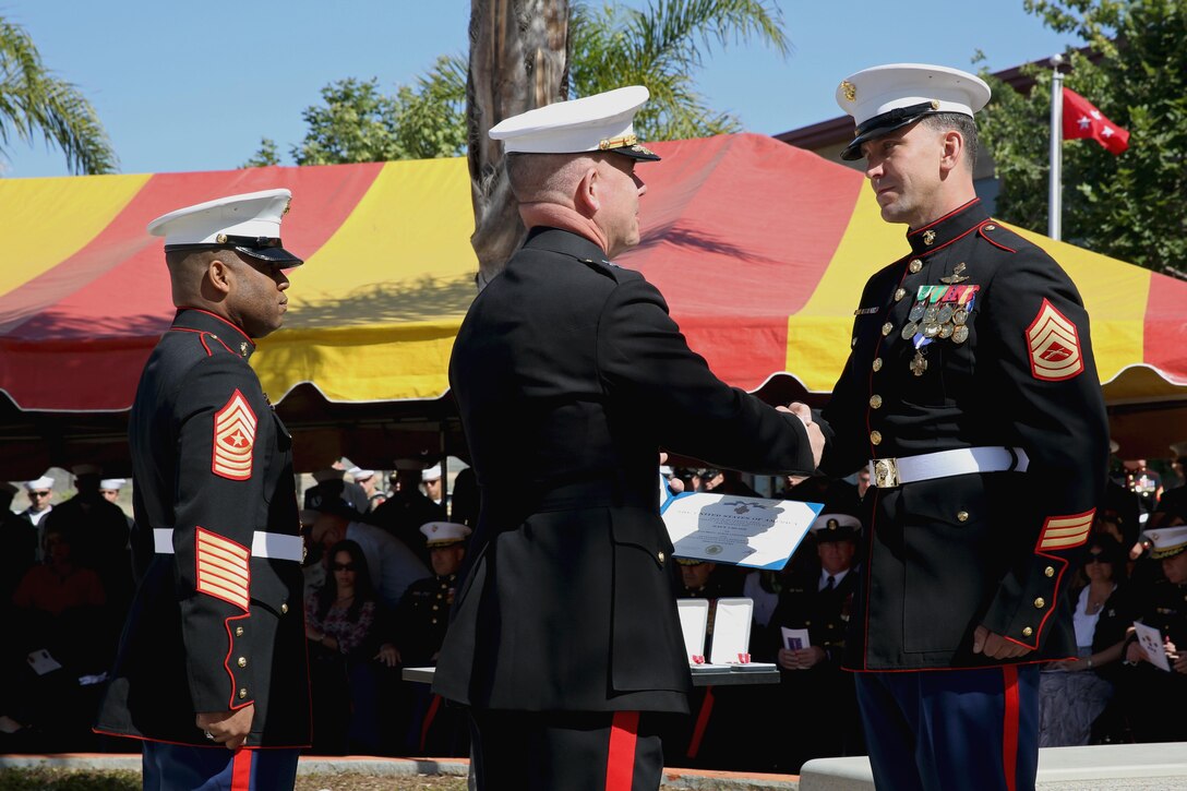 Major Gen. Joseph L. Osterman, commander, U.S. Marine Corps Forces, Special Operations Command, presents Gunnery Sgt. Brian C. Jacklin with the Navy Cross Medal, the second highest award for valor, at Marine Corps Base Camp Pendleton, Calif., April 9, 2015. Jacklin received the award in recognition of his actions during a two-day firefight with the Taliban in Helmand province, Afghanistan, which started June 14, 2012. (U.S. Marine Corps photo by Cpl. Steven Fox/Released)