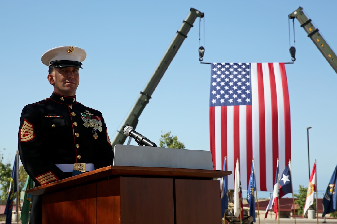 Gunnery Sgt. Brian C. Jacklin, a critical skills operator with U.S. Marine Corps Forces, Special Operations Command, delivers a speech after receiving the Navy Cross Medal at Marine Corps Base Camp Pendleton, Calif., April 9, 2015. Jacklin received the award in recognition of his actions during a two-day firefight with the Taliban in Helmand province, Afghanistan, which started June 14, 2012. (U.S. Marine Corps photo by Cpl. Steven Fox/Released)
