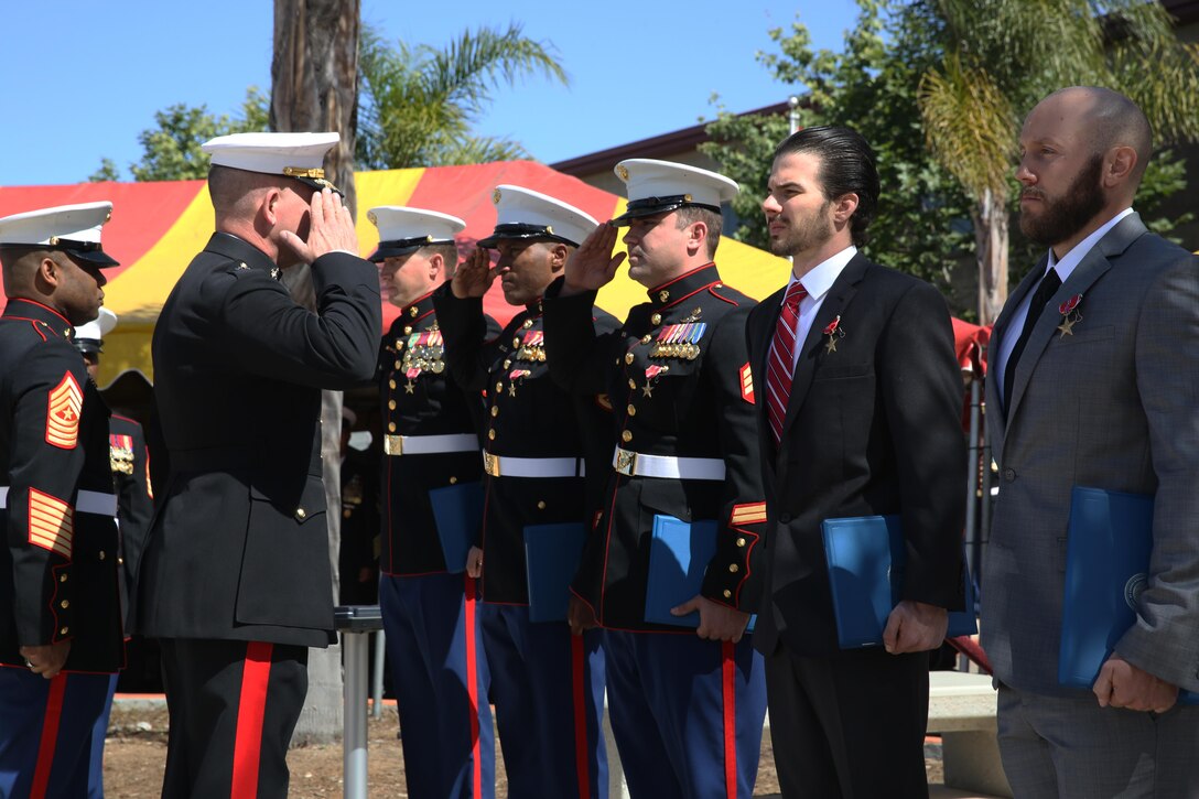 Major Gen. Joseph L. Osterman, commander, U.S. Marine Corps Forces, Special Operations Command, presents five Marines with Bronze Star Medals with valor distinguishing devices, at Marine Corps Base Camp Pendleton, Ca., April 9, 2015. The five Marines received the awards in recognition of their actions during a two-day fire fight with the Taliban in Helmand province, Afghanistan, which started June 14, 2012. (U.S. Marine Corps photo by Cpl. Steven Fox/Released)