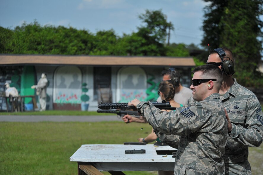 Air Force Special Operations Command's 2014 Outstanding Airmen and civilians of the year fired weapons at the U.S. Air Force Special Operations School Dynamics of International Terrorism demo May 13.  The award winners toured Hurlburt Field May 12 and 13 before being honored at the yearly awards banquet held May 14 to celebrate their accomplishments and 25 years of AFSOC history.