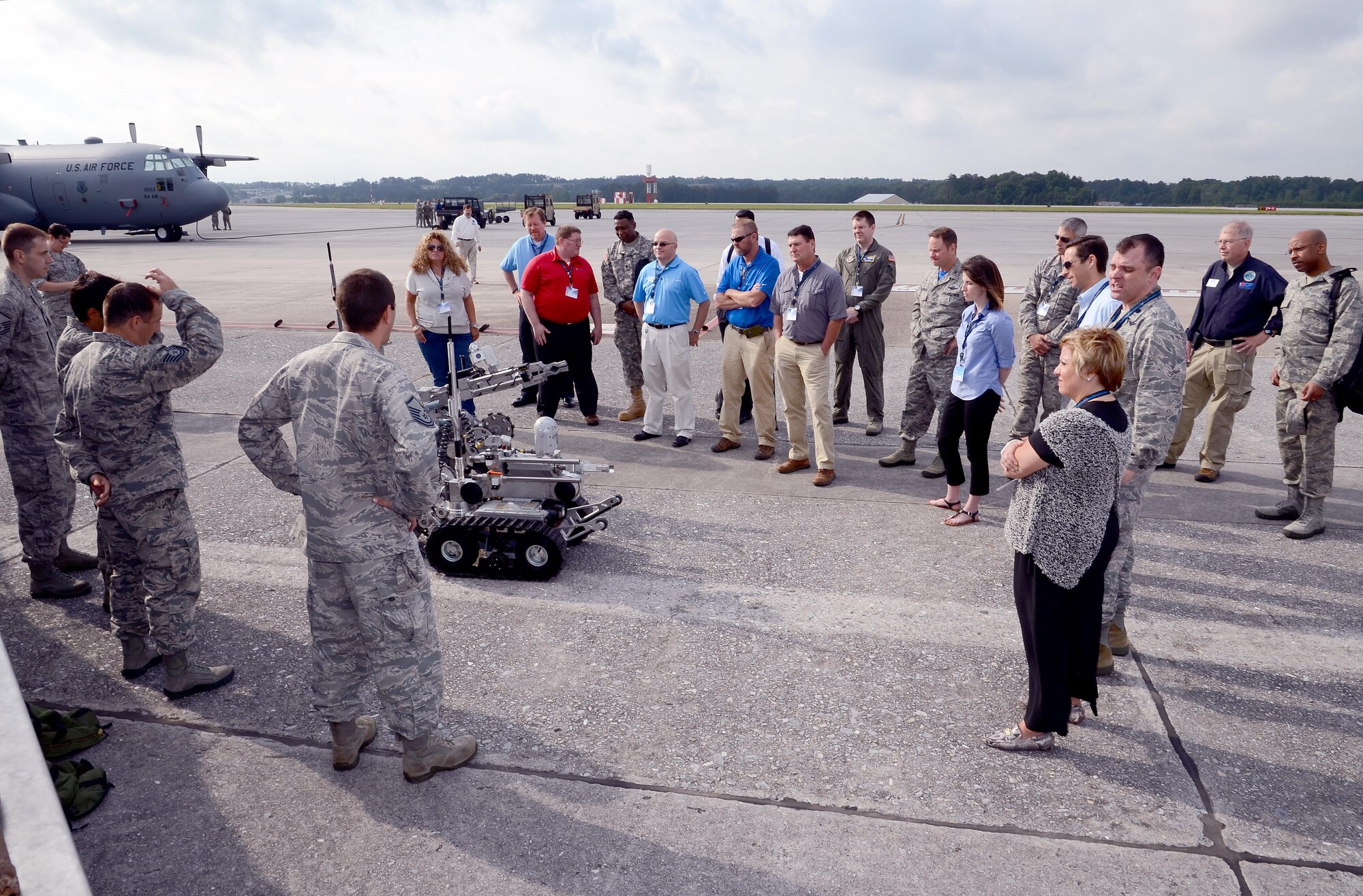 Members of 94th Explosive Ordinance Disposal flight demonstrate their robots to members of the Employers Support of the Guard and Reserve touring Dobbins Air Reserve Base, Ga., May 15, 2015. The ESGR tour of Dobbins ARB was arranged to provide a hands-on understanding of what their Air Force Reserve employees experience when deployed to the theater of operations. (U.S. Air Force photo/ Brad Fallin)