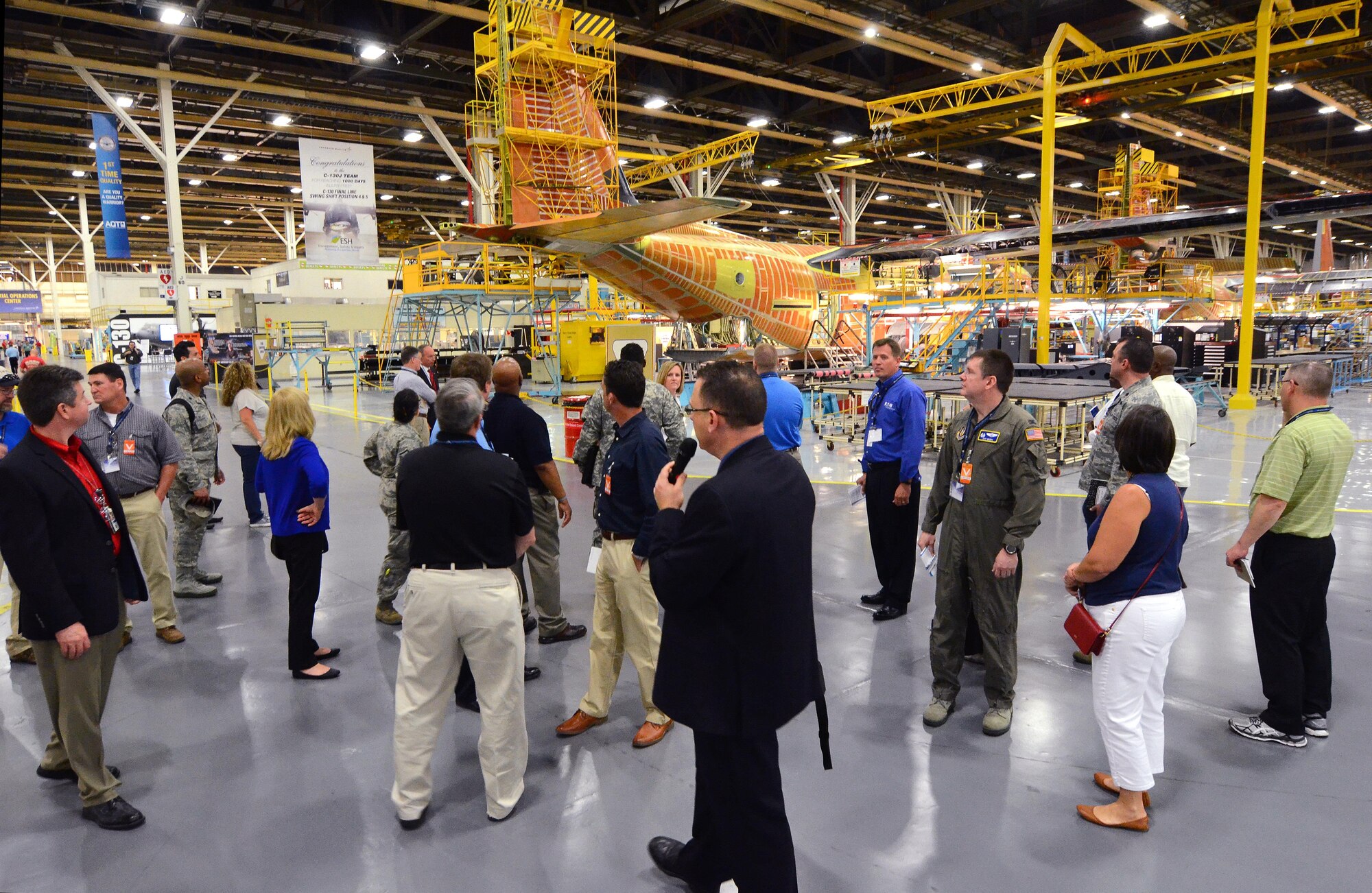 Members of the Employers Support of the Guard and Reserve tour Lockheed Martin Aeronautics C-130J production line located on Dobbins Air Reserve Base, Ga., May 15, 2015. The ESGR tour of Dobbins ARB was arranged to provide a hands-on understanding of what their Air Force Reserve employees experience when deployed to the theater of operations. (U.S. Air Force photo/ Brad Fallin)