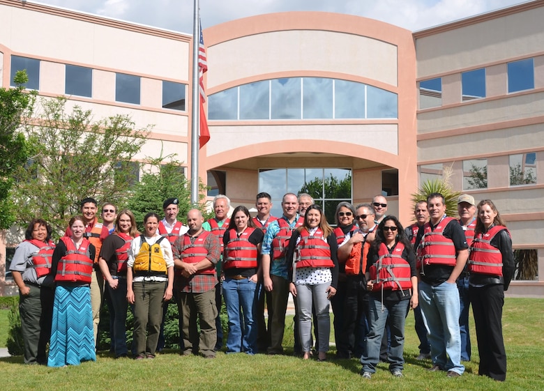 ALBUQUERQUE, N.M. -- Approximately 25 District staff pose with their life jackets as part of the Safe Boating Council’s “Wear Your Lifejacket to Work Day” May 15, 2015. 