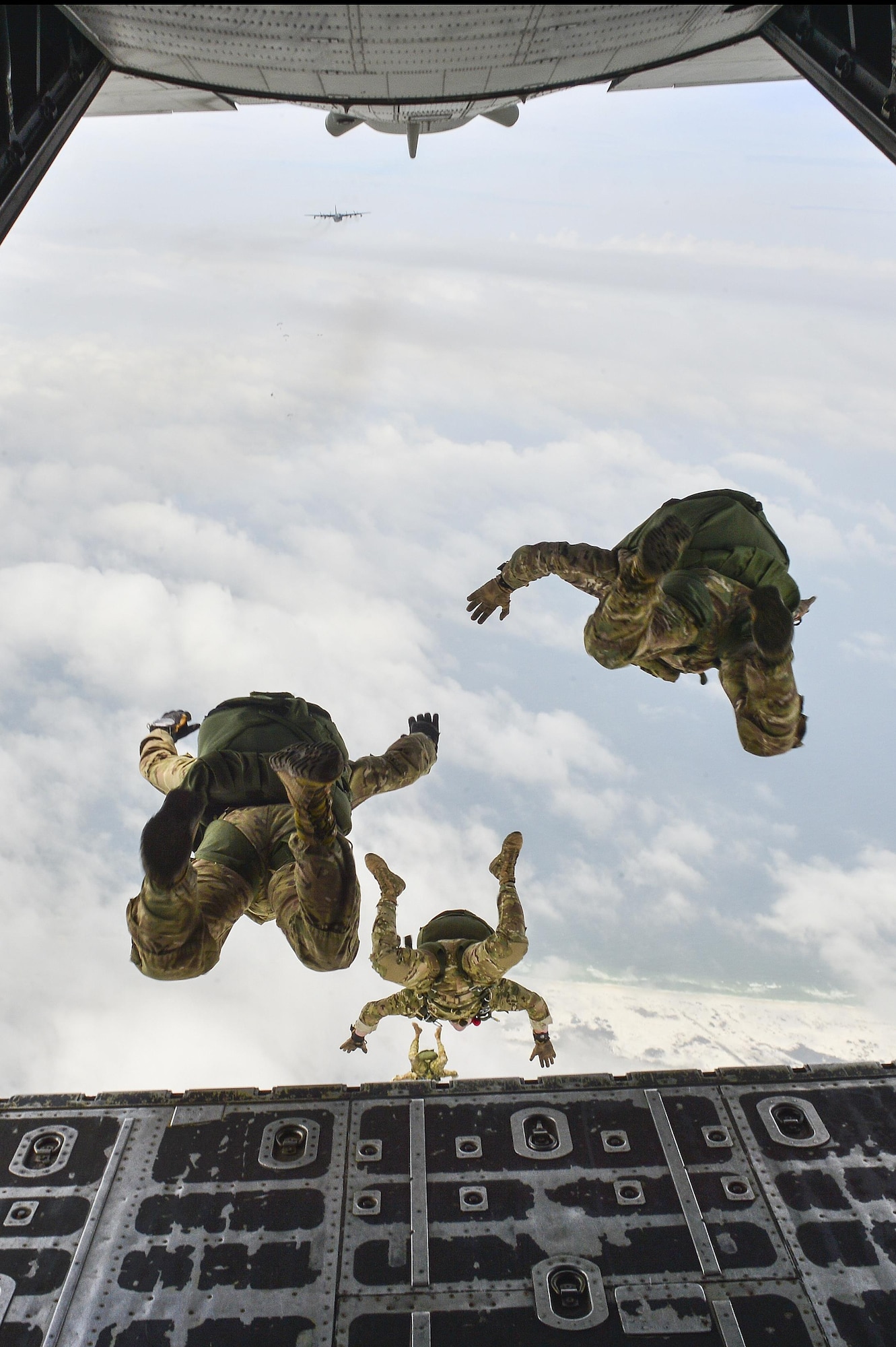 Members of the 7th Special Forces Group perform a High Altitude Low Opening jump from an MC-130P Combat Shadow over Hurlburt Field, Fla., May 15, 2015. The final two MC-130P Combat Shadow aircraft in the Air Force landed for the last time at Hurlburt Field, Fla., in front of more than 400 people and will take their last flight to the boneyard at Davis-Monthan Air Force Base, Arizona, June 1. (U.S. Air Force photo/Senior Airman Jeff Parkinson)