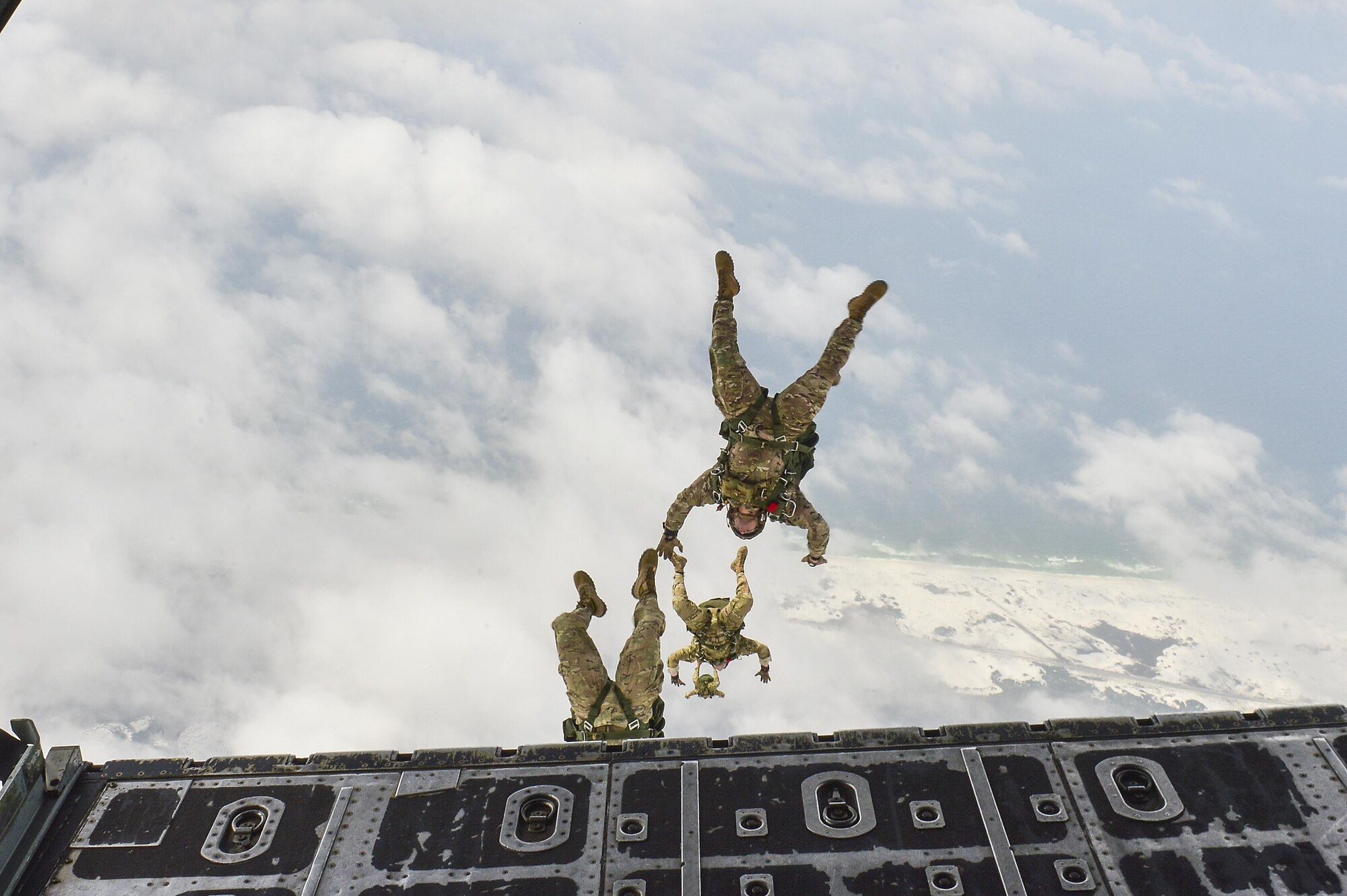 Members of the 7th Special Forces Group perform a High Altitude Low Opening jump from an MC-130P Combat Shadow over Hurlburt Field, Fla., May 15, 2015. The final two MC-130P Combat Shadow aircraft in the Air Force landed for the last time at Hurlburt Field, Fla., in front of more than 400 people and will take their last flight to the boneyard at Davis-Monthan Air Force Base, Arizona, June 1. (U.S. Air Force photo/Senior Airman Jeff Parkinson)