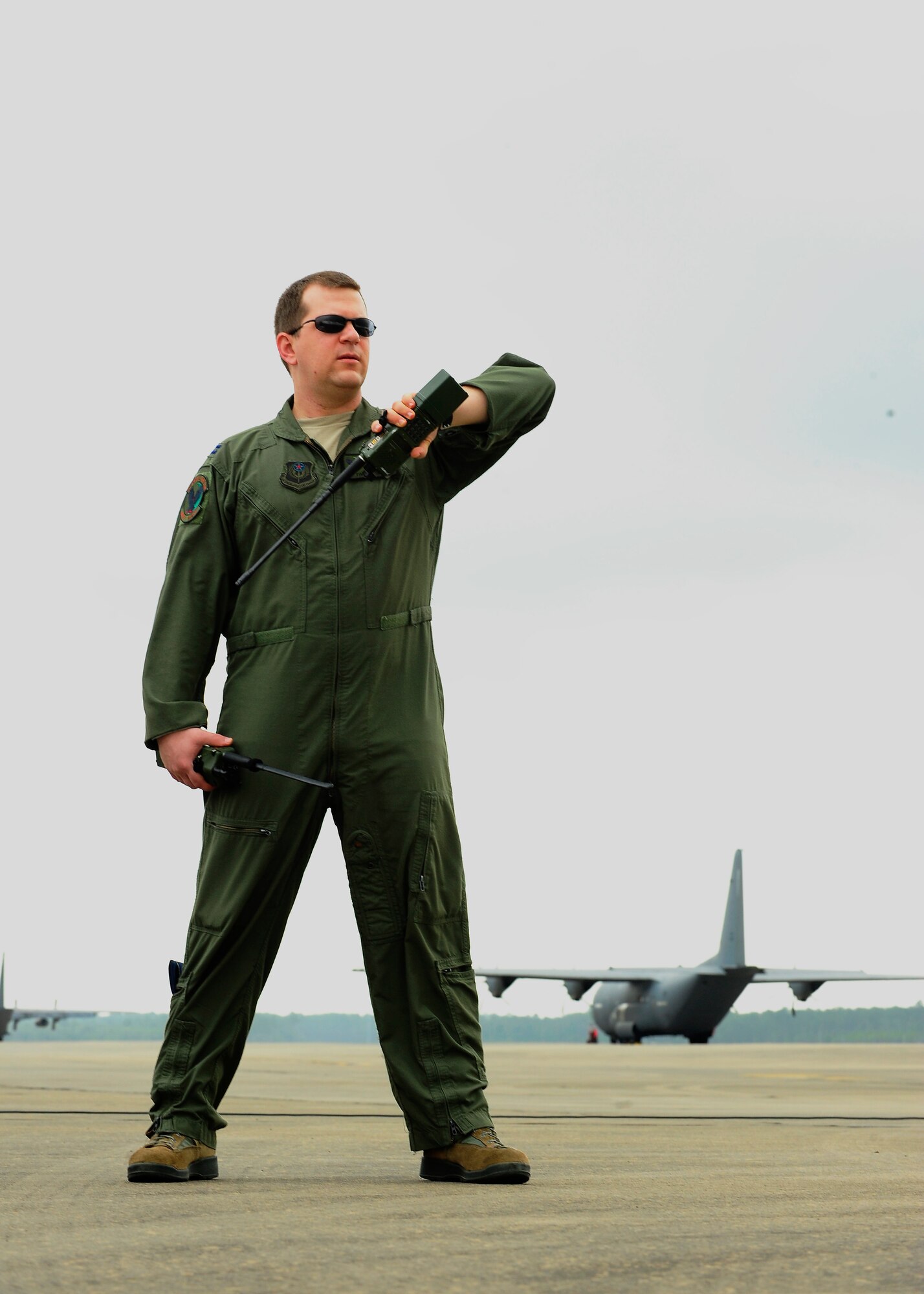 Capt. Tim Nettles, 1st Special Operations Group Detachment 1 pilot, listens to instructions from the MC-130P Combat Shadow aircraft during a heritage flight at Hurlburt Field Fla., May 15, 2015. Aircrafts 66-0217 and 69-5819 are the last two MC-130P Combat Shadow aircraft in the Air Force to be retired. On June 1, 217 and 819 will take their last flight to the boneyard at Davis-Monthan Air Force Base, Arizona. (U.S. Air Force photo/Airman 1st Class Andrea Posey)