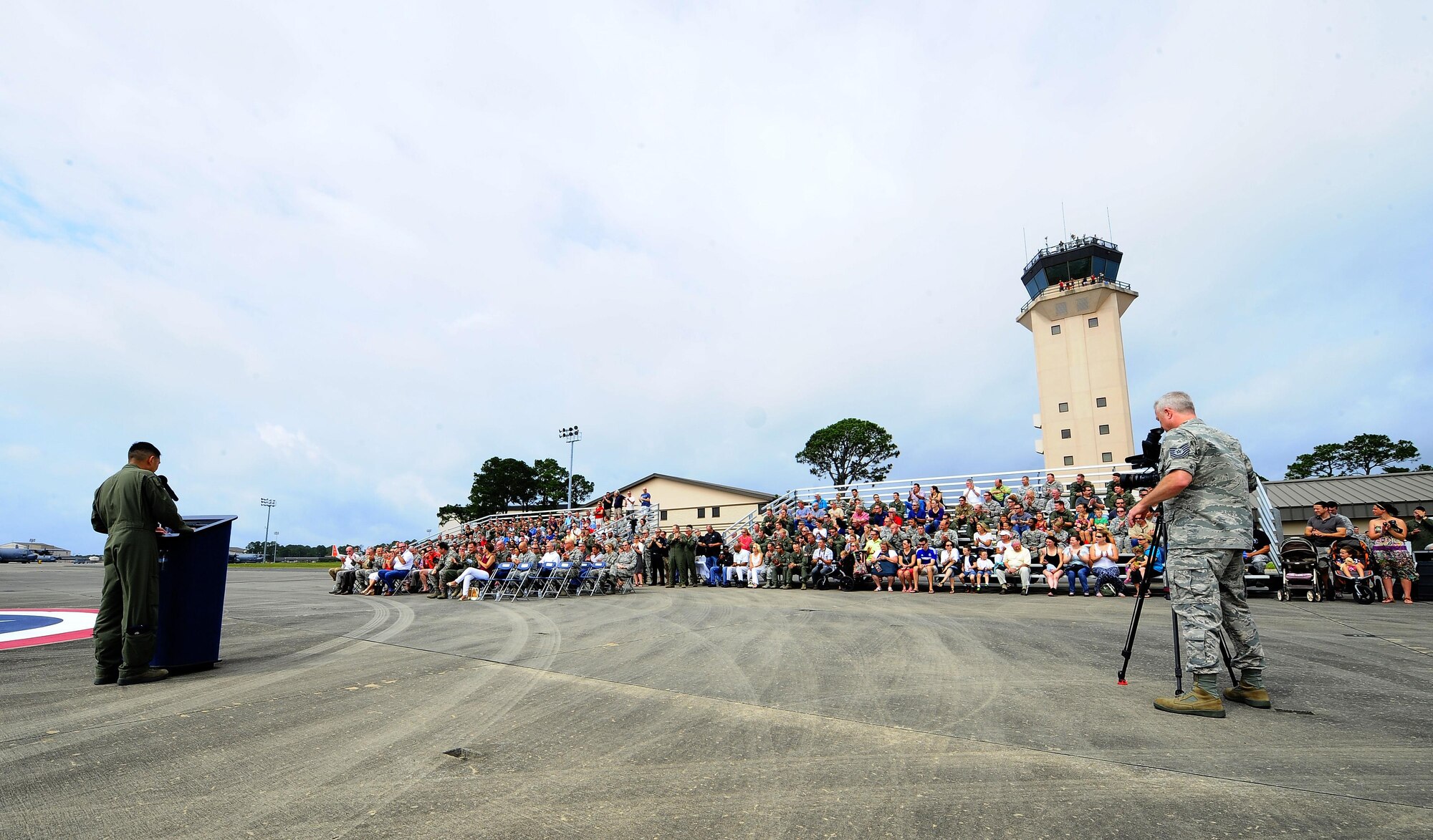 Lt. Col. Sam Kwan, 1st Special Operations Group Detachment 1 commander, speaks at the MC 130 P Combat Shadow aircraft retiring air show at Hurlburt Field Fla., May 15, 2015. The final two MC-130P Combat Shadow aircraft in the Air Force landed for the last time at Hurlburt Field, Fla., in front of more than 400 people and will take their last flight to the boneyard at Davis-Monthan Air Force Base, Arizona, June 1. (U.S. Air Force photo/Airman 1st Class Andrea Posey)