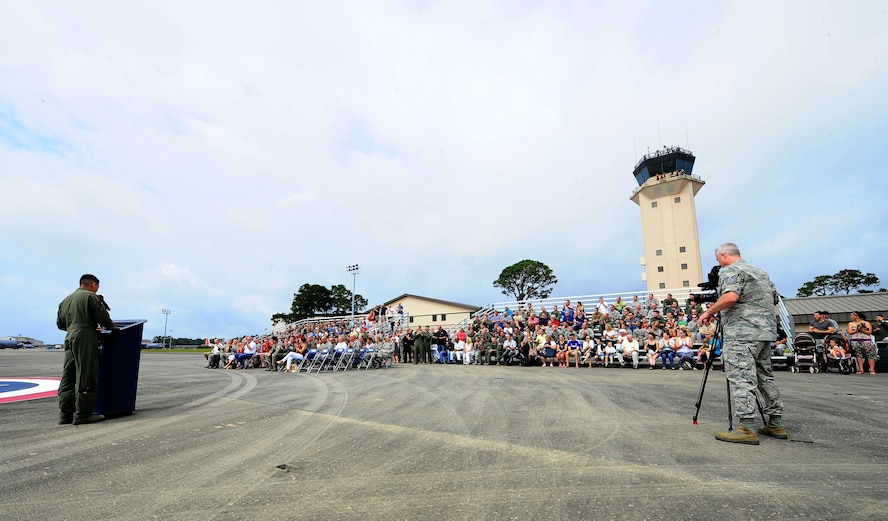 Lt. Col. Sam Kwan, 1st Special Operations Group Detachment 1 commander, speaks at the MC 130 P Combat Shadow aircraft retiring air show at Hurlburt Field Fla., May 15, 2015. The final two MC-130P Combat Shadow aircraft in the Air Force landed for the last time at Hurlburt Field, Fla., in front of more than 400 people and will take their last flight to the boneyard at Davis-Monthan Air Force Base, Arizona, June 1. (U.S. Air Force photo/Airman 1st Class Andrea Posey)