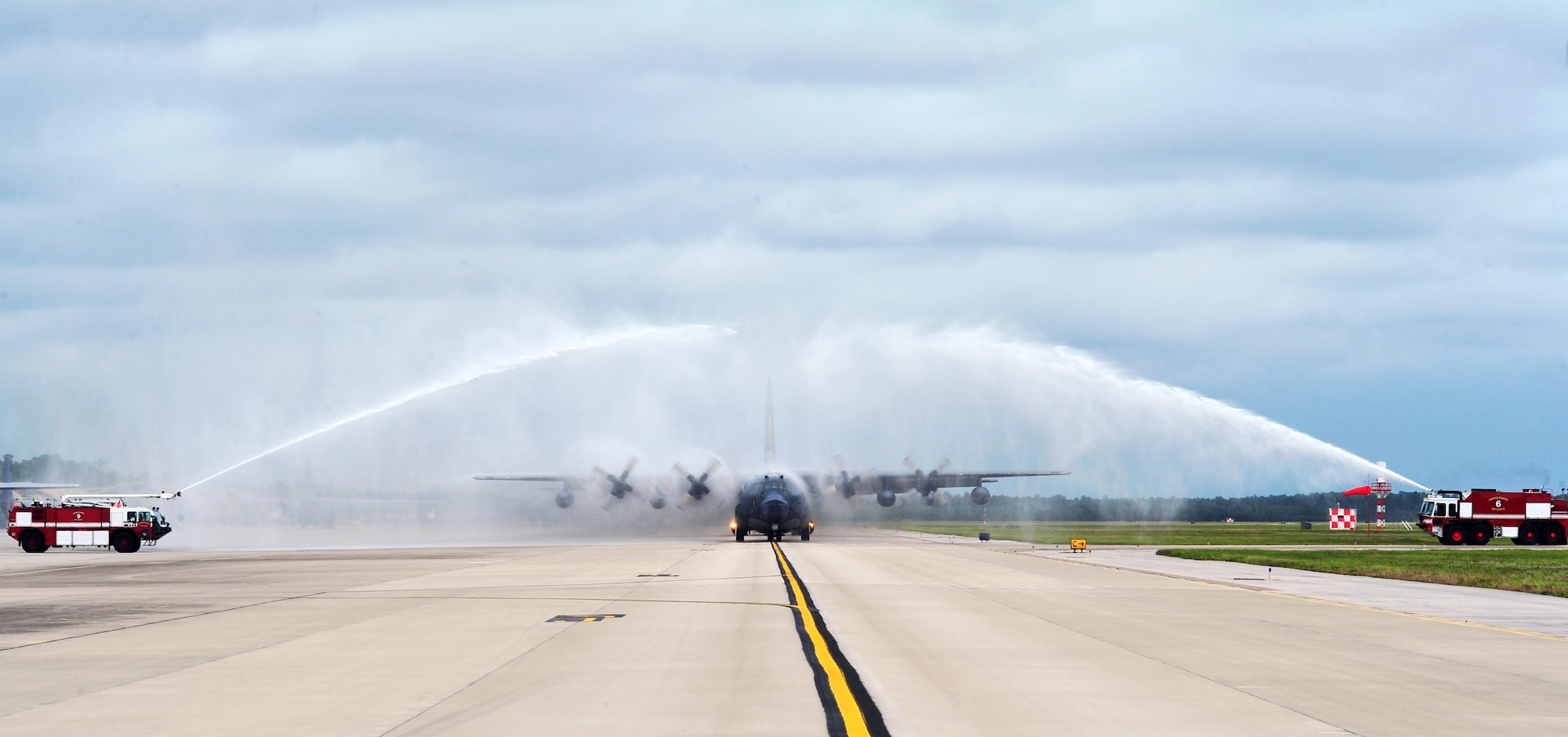 Fire trucks spray water over an MC-130P Combat Shadow after its final flight, May 15, 2015, at Hurlburt Field, Fla. The final two MC-130P Combat Shadow aircraft in the Air Force landed for the last time at Hurlburt Field, Fla., in front of more than 400 people and will take their last flight to the boneyard at Davis-Monthan Air Force Base, Arizona, June 1. (U.S. Air Force photo/Airman 1st Class Ryan Conroy) 
