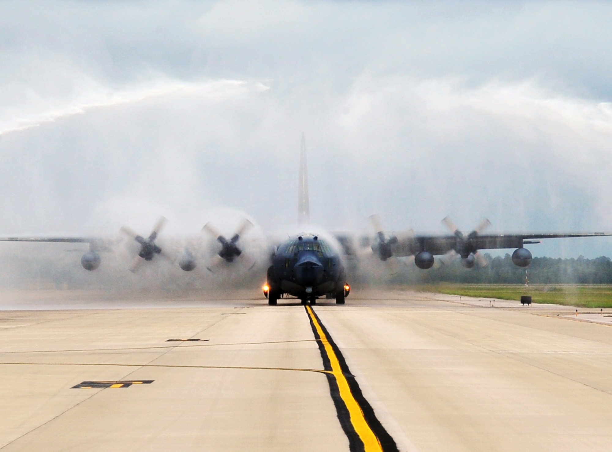 Fire trucks spray water over an MC-130P Combat Shadow after its final flight, May 15, 2015, at Hurlburt Field, Fla. Built with 1960s technology, the MC-130P began its special operations career in the mid-1980s and went on to conduct critical air refueling missions in the late 1980s during Operation Just Cause in Panama and the early 1990s during Operation Desert Storm. (U.S. Air Force photo/Airman 1st Class Ryan Conroy) 
