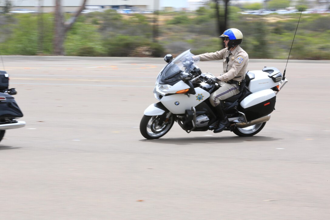 A motorcycle patrol officer with the California Highway Patrol demonstrates advanced riding techniques after a motorcycle safety awareness press conference aboard Marine Corps Air Station Miramar, California, May 14. The demonstration is a part of a course all Marines who ride a motorcycle must attend.