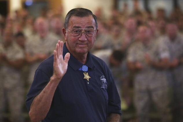 Col. Jay R. Vargas, a Congressional Medal of Honor recipient, waves at the camera after speaking to service members about the importance of finding help for those suffering from post-traumatic stress disorder May 12, 2015, at the Chaplain Joseph W. Estabrook Chapel aboard Marine Corps Base Hawaii. (U.S. Marine Corps photo by Lance Cpl. Harley Thomas/Released)