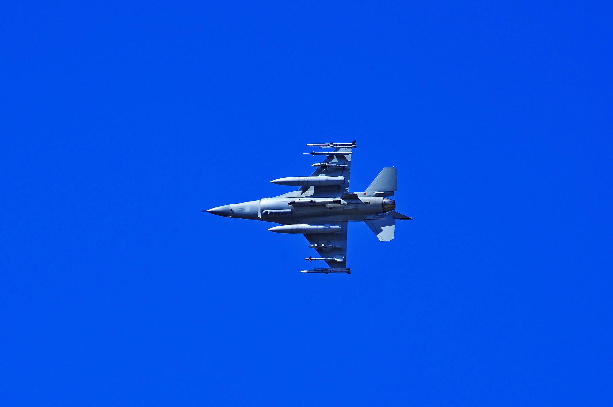 A U.S. Air Force F-16 Fighting Falcon aircraft assigned to the 113th Wing, District of Columbia Air National Guard, prepares to land May 14, 2015, after a sortie during RED FLAG-Alaska (RF-A) 15-2 at Eielson Air Force Base, Alaska. RF-A enables joint and international partners to sharpen their combat skills by flying simulated combat sorties in a realistic threat environment. Additionally, the training allows an exchange of tactics, techniques and procedures while improving interoperability. (U.S. Air Force photo by Tech. Sgt. Miguel Lara III/Released)