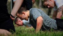 Staff Sgt. Brett Kiser, 8th Civil Engineer Squadron Airman Dormitory Leader, participates in the push-up portion of the defender challenge May 14, 2015, at Kunsan Air Base Republic of Korea. Kunsan’s observance of National Police Week included demonstrations by the military work dog section, combat arms and weapons display, crime prevention skits, defender challenge and a retreat ceremony. (U.S. Air Force photo by Staff Sgt. Nick Wilson/Released)