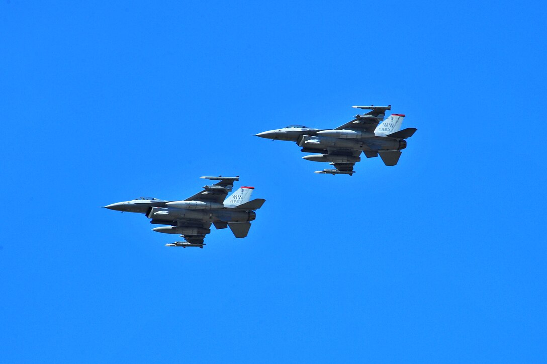 U.S. Air Force F-16 Fighting Falcon aircraft assigned to the 13th Fighter Squadron, Misawa Air Base, Japan, prepare to land May 14, 2015, after a RED FLAG-Alaska (RF-A) 15-2 mission at Eielson Air Force Base, Alaska.  RF-A allows participating units to exchange tactics, techniques and procedures as well as improve interoperability. (U.S. Air Force photo by Tech. Sgt. Miguel Lara III/Released)